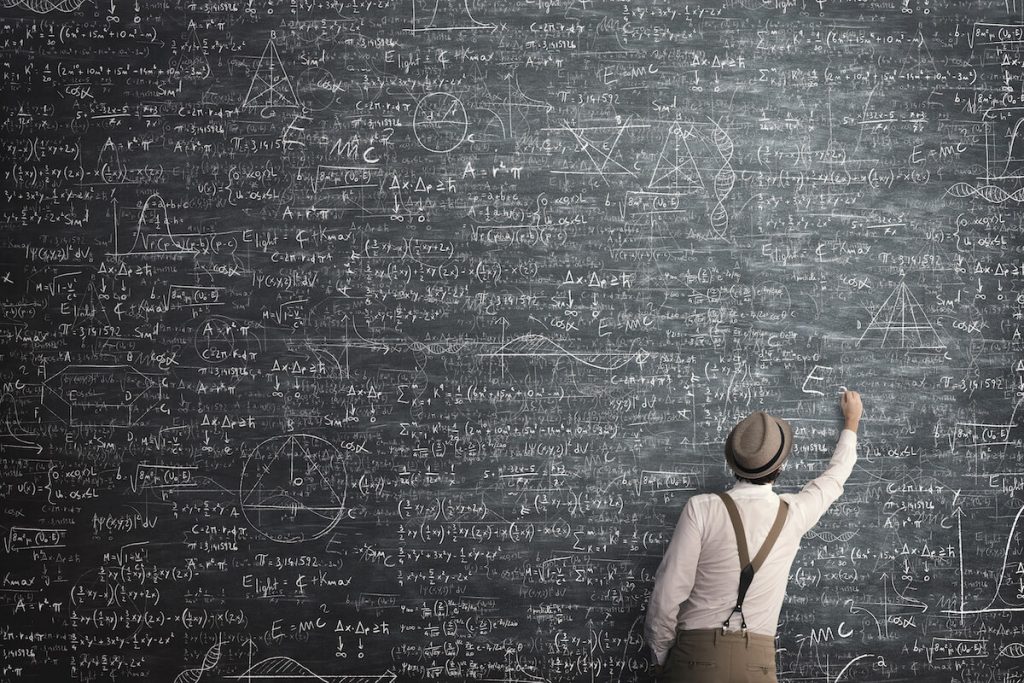 Person writing on a blackboard